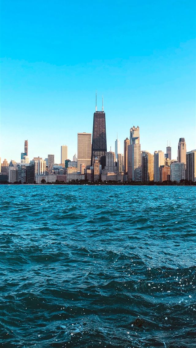 1290x2796 building beside sea under clear blue sky -  iphone 14 Wallpaper