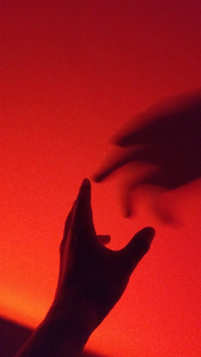 1290x2796 person's hand with shadow - red iPhone Wallpaper