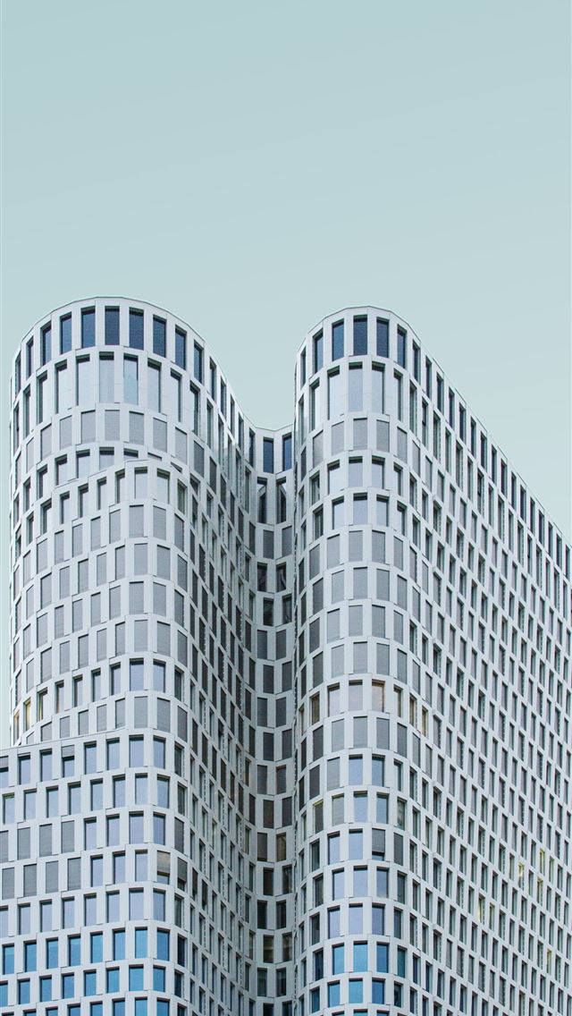1290x2796 concrete building under white sky during daytime - windows iPhone Wallpaper