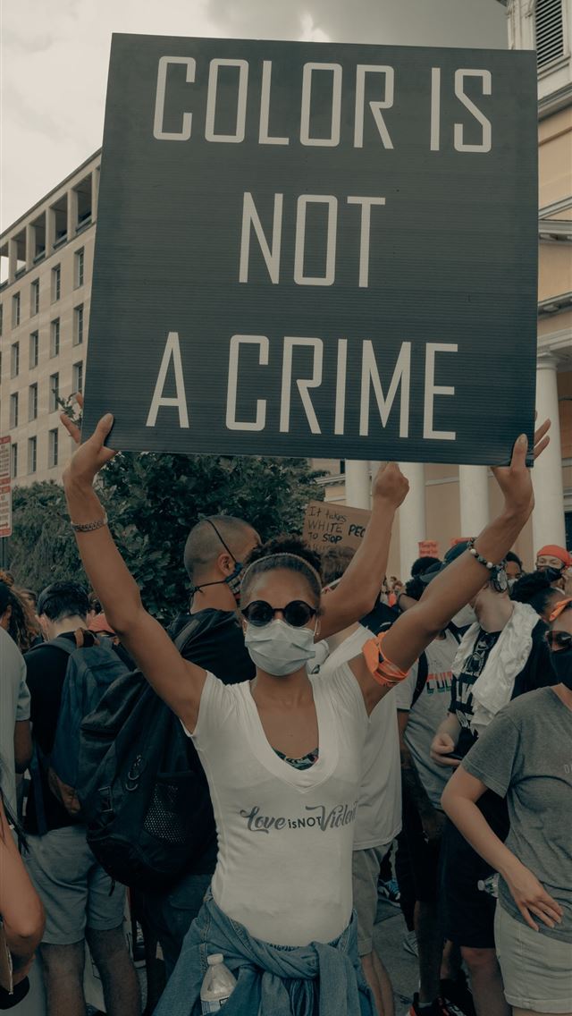 1290x2796 a group of people holding a sign that says color i... - quotes iPhone Wallpaper