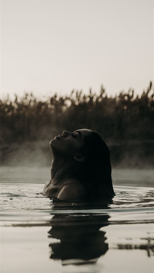 1242x2688 woman in body of water - bear iPhone Wallpaper