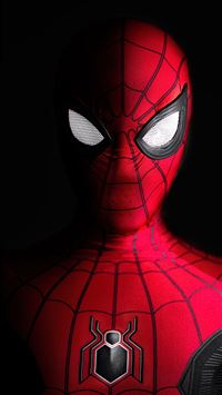 a close up of a spider man with glowing eyes wallpaper