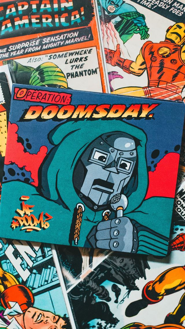 1290x2796 a pile of comic books sitting on top of a table -  iphone 14 Wallpaper