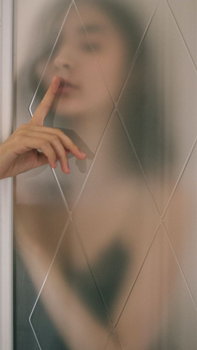 1290x2796 woman doing silence sign behind of mirror - abstract iPhone Wallpaper