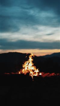 bonfire near body of water during night time iPhone Wallpapers Free Download