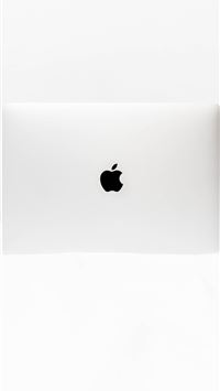 MacBook White open on white surface wallpaper