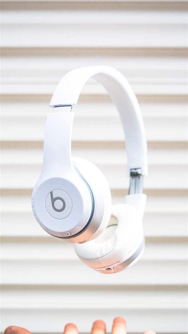 1290x2796 white Beats by Dr Dre headphones on mid air - music iPhone Wallpaper