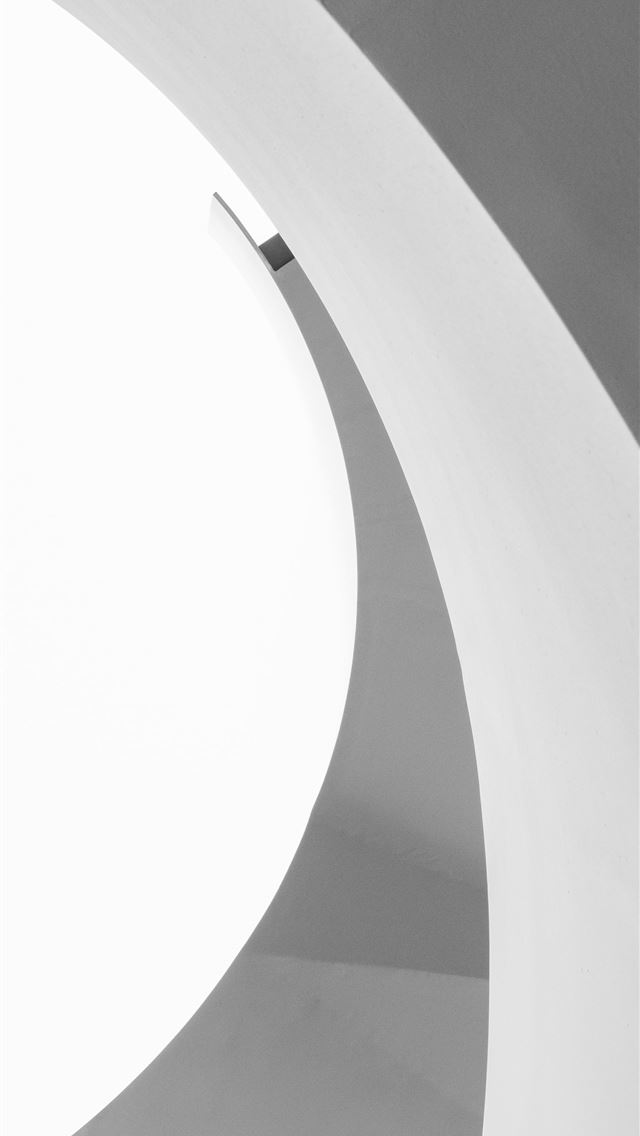 1290x2796 a black and white photo of a person on a skateboar... - plain iPhone Wallpaper