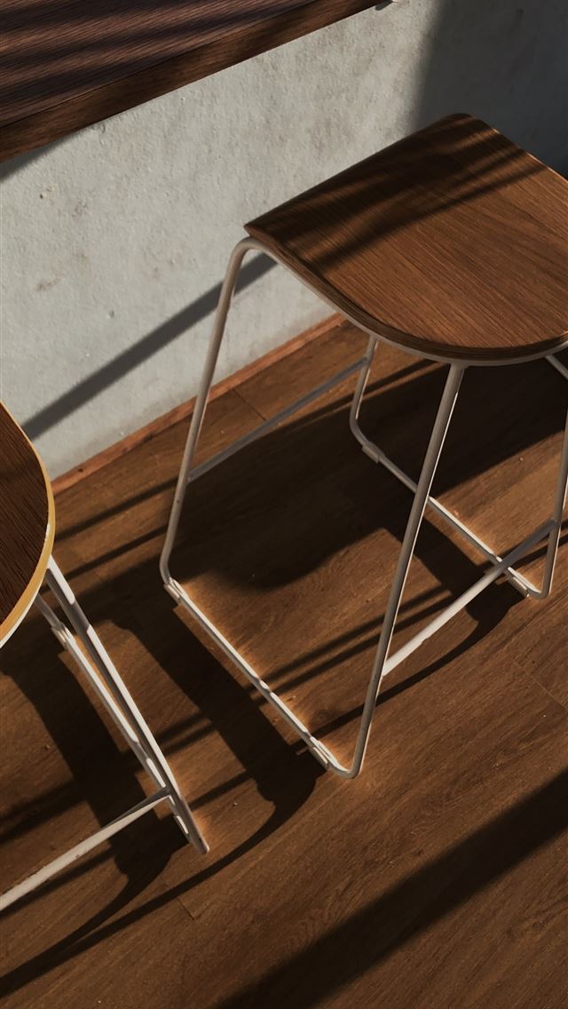 640x1136 brown wooden chair beside white wall -  iPhone Wallpaper