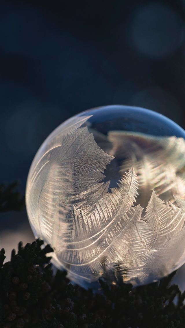 1290x2796 closeup photography of glass ball - texture iPhone Wallpaper