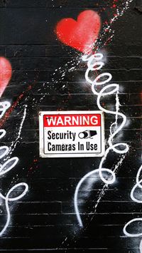 black security camera in use poster wallpaper