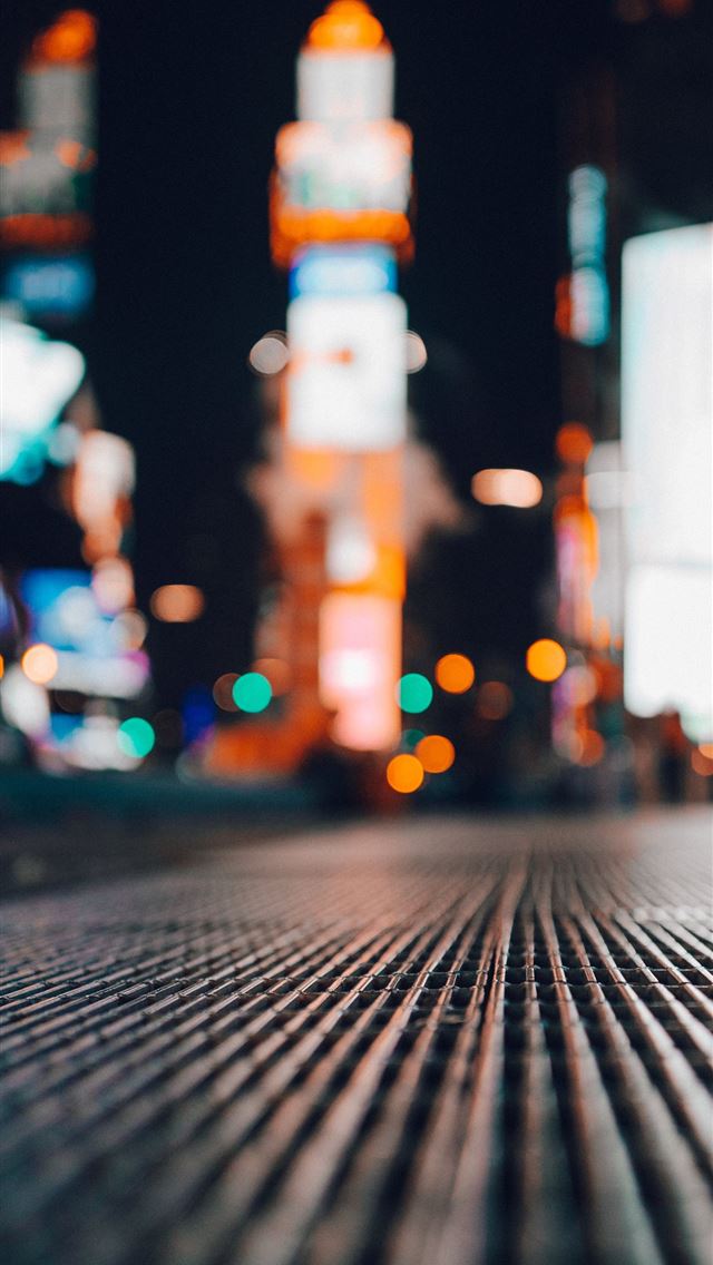 1290x2796 shallow focus of drainage cover during daytime - new york city iPhone Wallpaper
