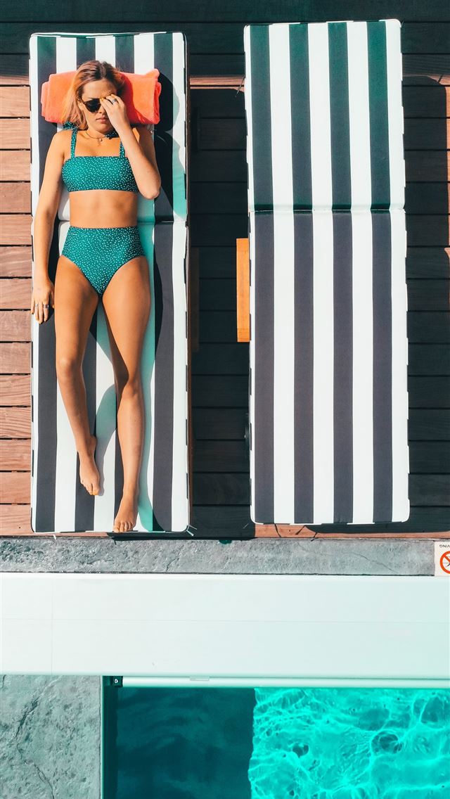 1290x2796 woman wearing bikini lying on pool lounger - girl iPhone Wallpaper