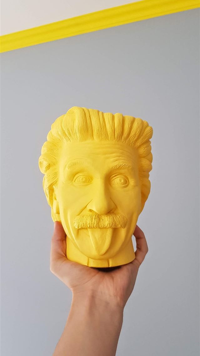 1290x2796 a person holding up a yellow face mask - art iPhone Wallpaper