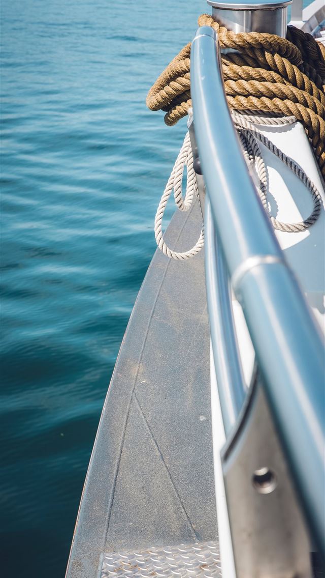 1290x2796 a view of the deck of a boat in the water - wave iPhone Wallpaper