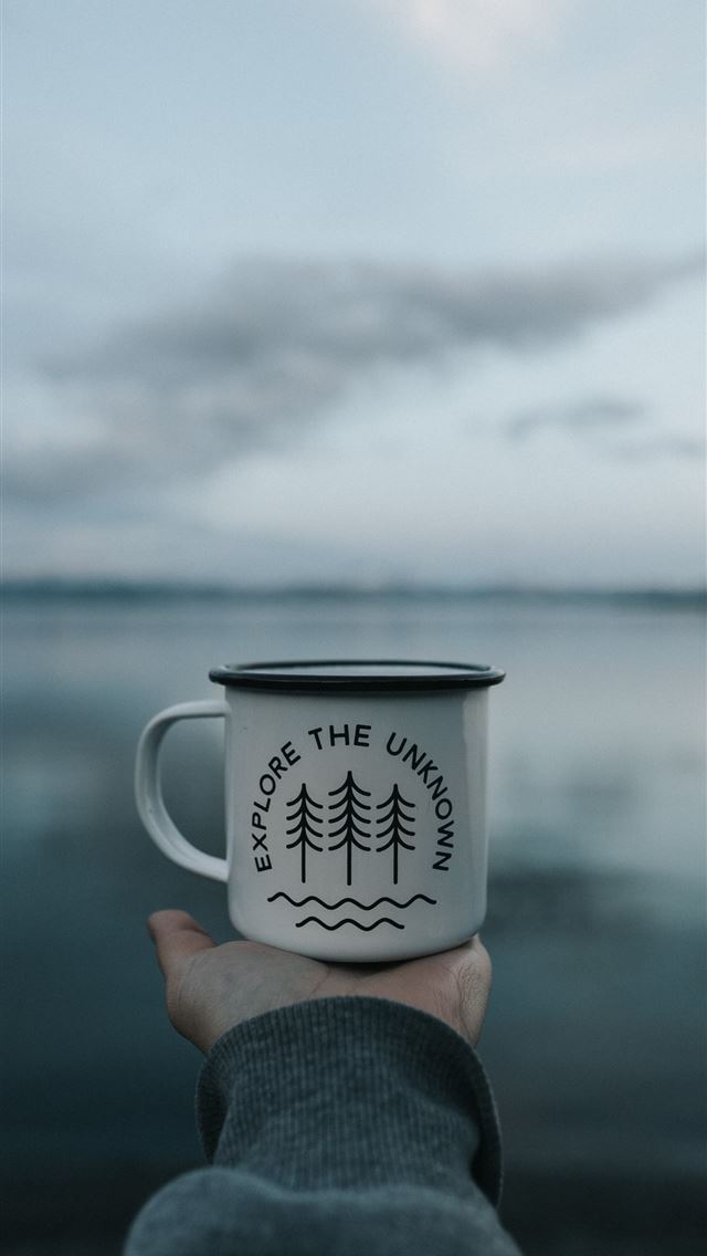 1290x2796 person holding white mug - simple iPhone Wallpaper