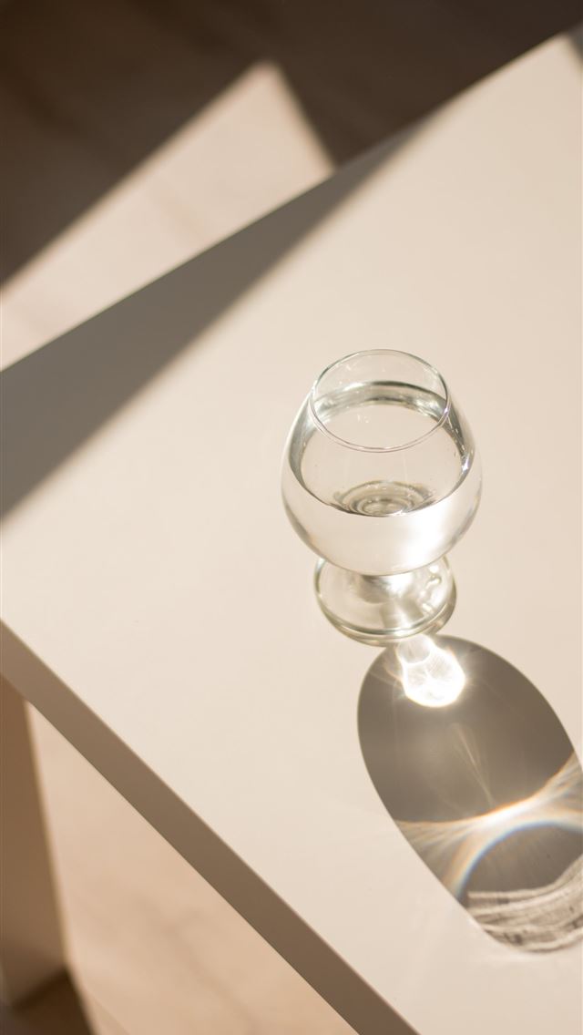 1290x2796 clear glass ball on white wooden table - aesthetic iPhone Wallpaper