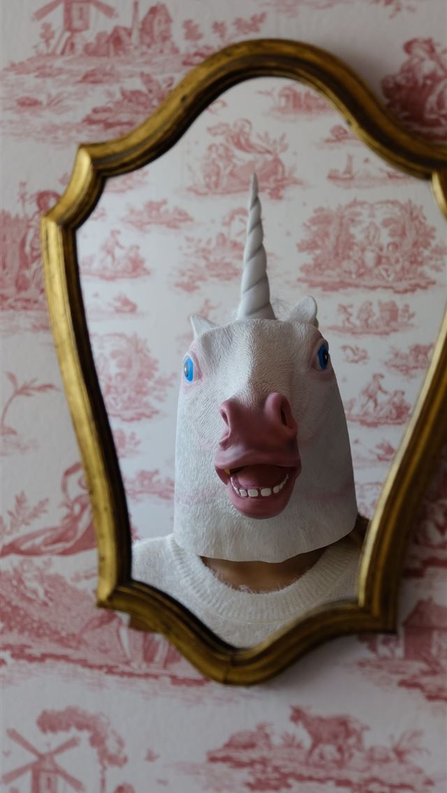 1290x2796 person with white unicorn mask stands in front of ... - cat iPhone Wallpaper