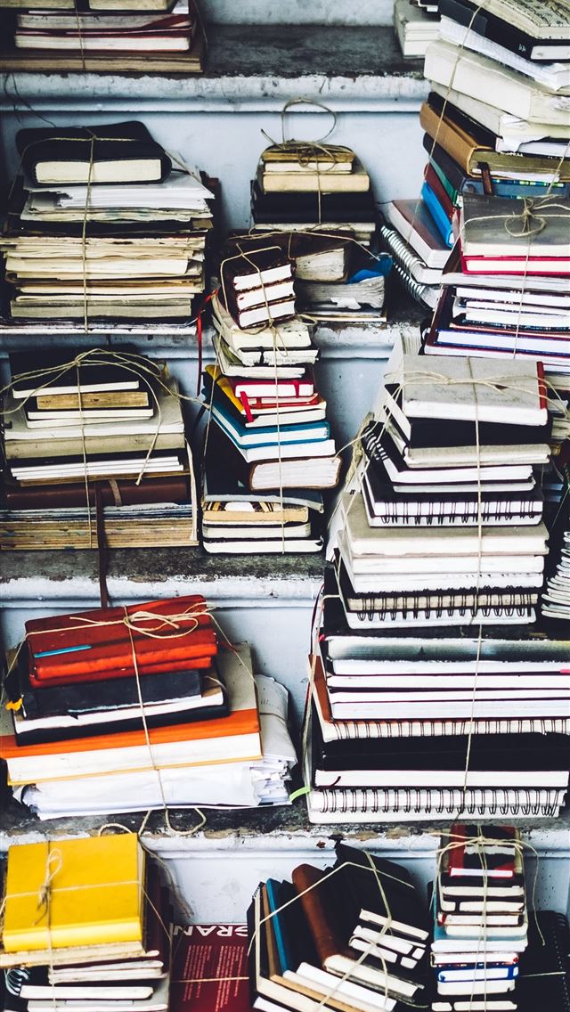 1290x2796 closeup photo of assorted color book lot - paper iPhone Wallpaper