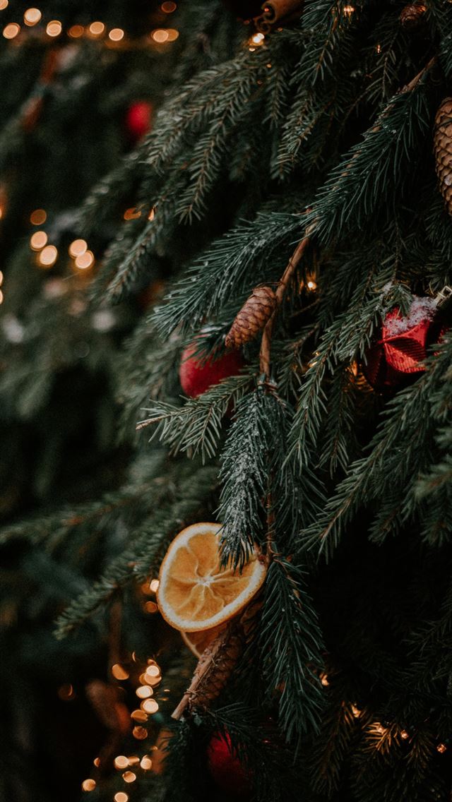 1290x2796 gold christmas baubles on green christmas tree -  iphone 15 Wallpaper