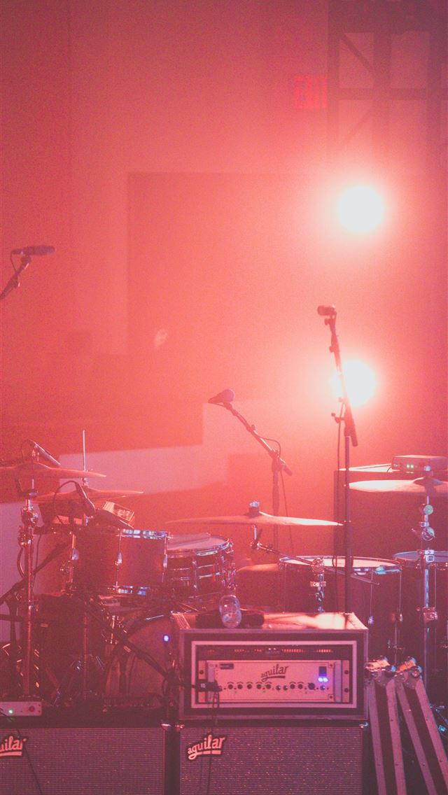 1290x2796 red drum set besides microphone stands - music iPhone Wallpaper