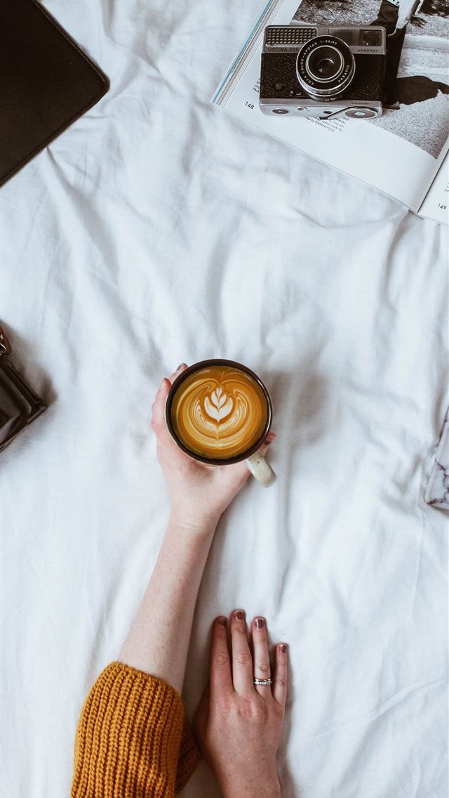 1290x2796 person holding coffee on white glass - paper iPhone Wallpaper