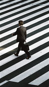 man in black formal suit jacket and pants carrying... wallpaper