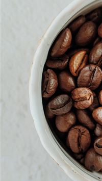 brown coffee beans on white ceramic bowl wallpaper