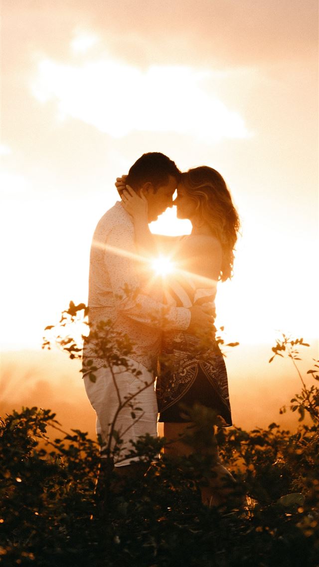 1290x2796 man and woman standing and touching foreheads duri... - love iPhone Wallpaper