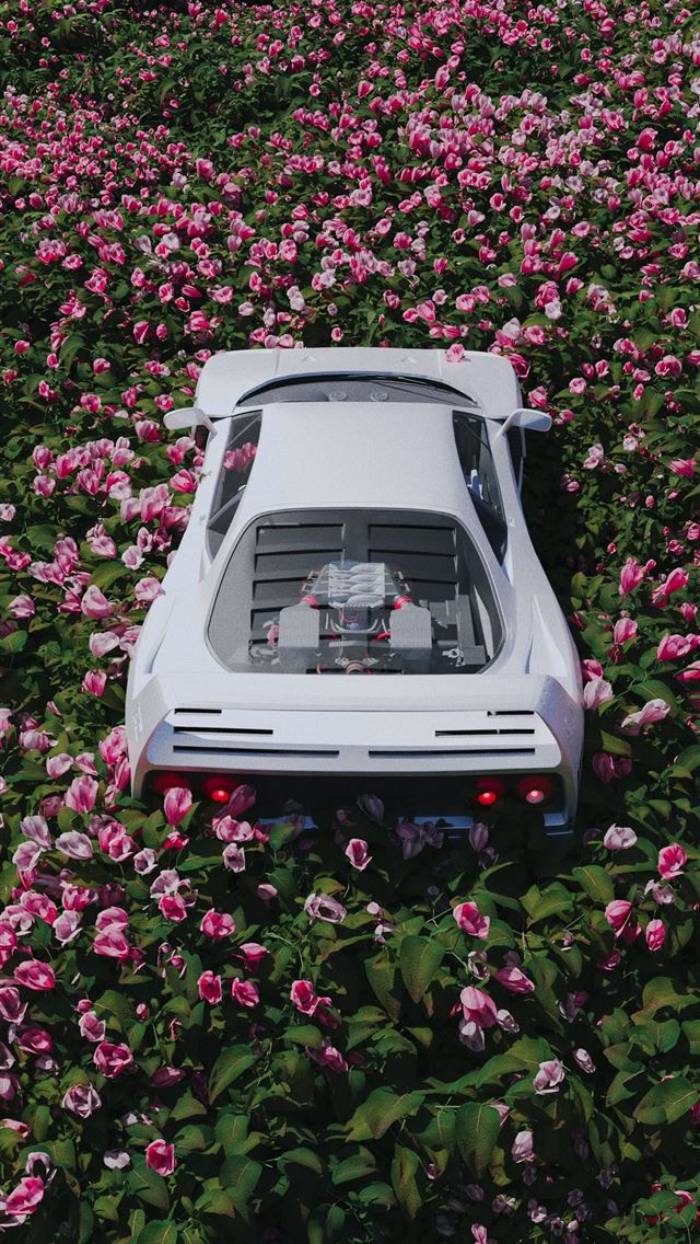 1290x2796 a car is parked in a field of flowers -  iphone 15 Wallpaper