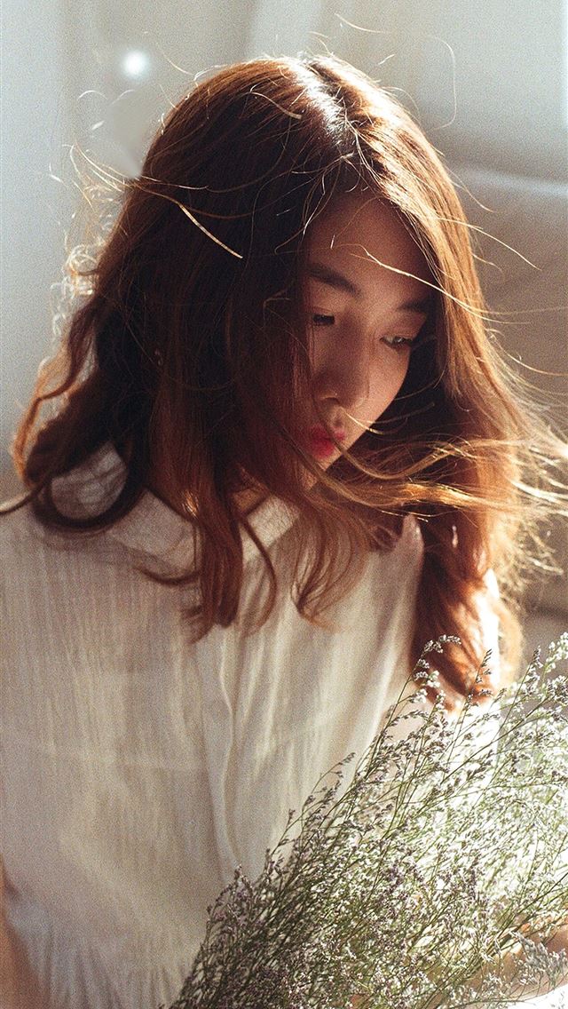 1290x2796 woman in white shirt holding green plant - lovely iPhone Wallpaper
