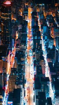 aerial view of city buildings during night time wallpaper