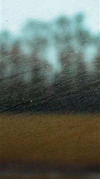 a blurry picture of a building in the distance wallpaper