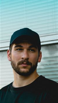 man standing in front of window wallpaper