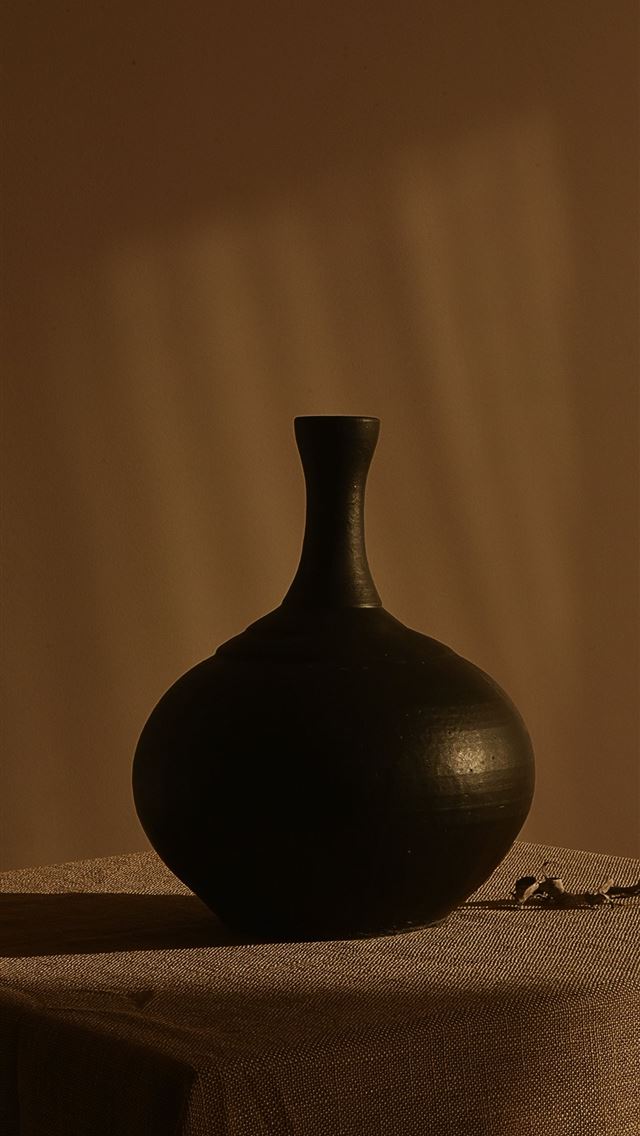 1290x2796 black ceramic vase on white textile -  iphone 15 Wallpaper
