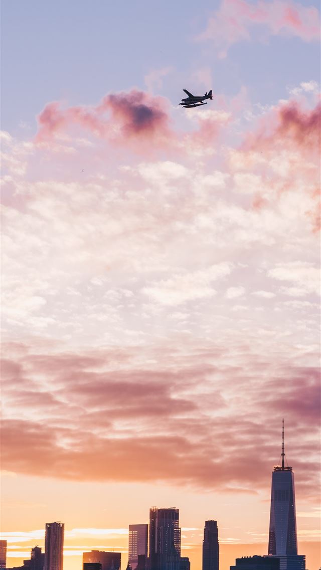 1290x2796 silhouette of plane flight over the city - sky iPhone Wallpaper