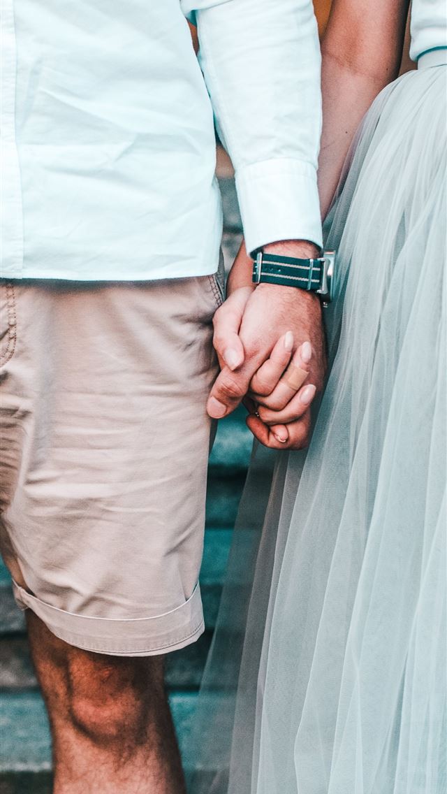 1290x2796 man and woman holding hands while standing - love iPhone Wallpaper