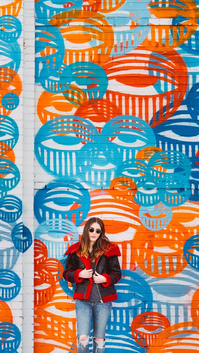 1290x2796 woman standing beside on wall street art - colorful iPhone Wallpaper