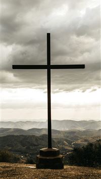 black cross outdoor during daytime wallpaper