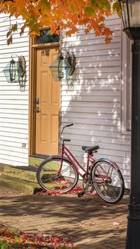 red bike beside house wallpaper
