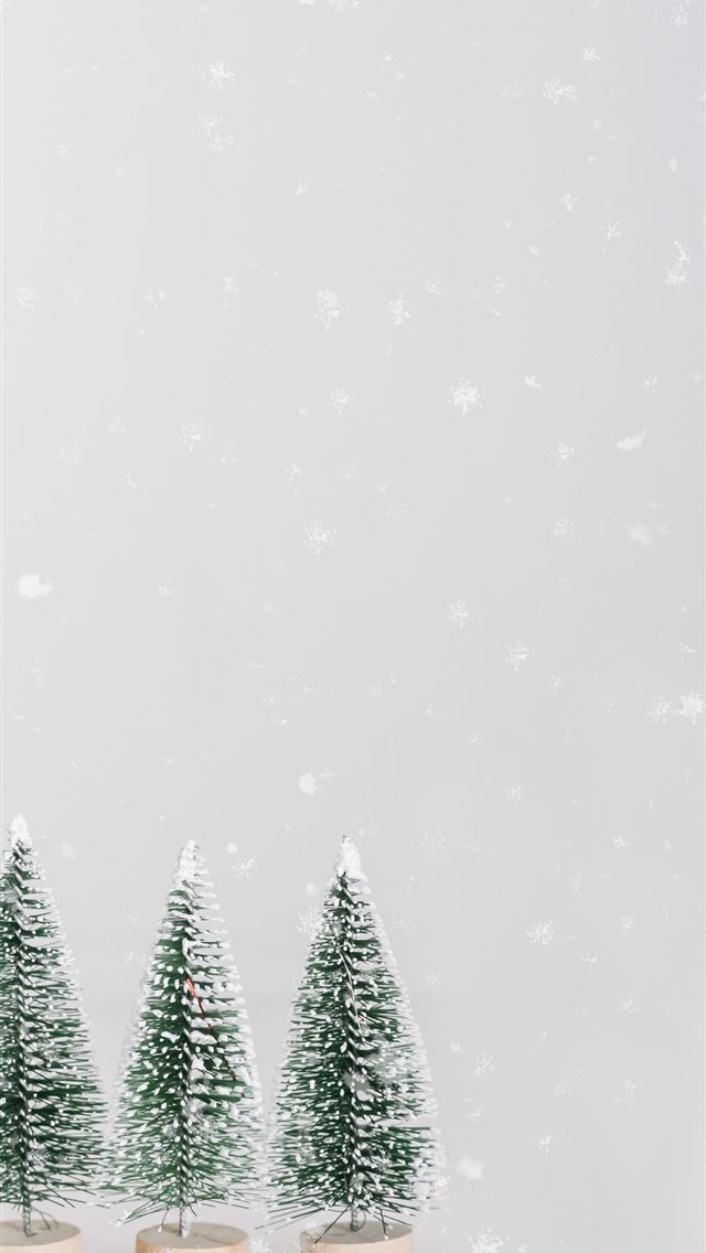 1290x2796 green pine trees under snowy weather - happy holidays iPhone Wallpaper