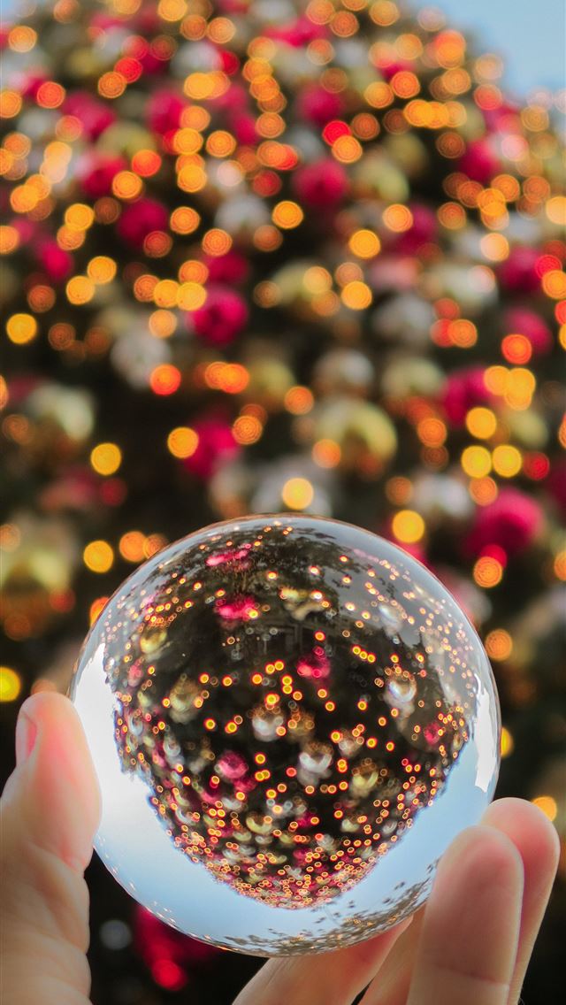 1290x2796 person holding baoding ball - christmas iPhone Wallpaper