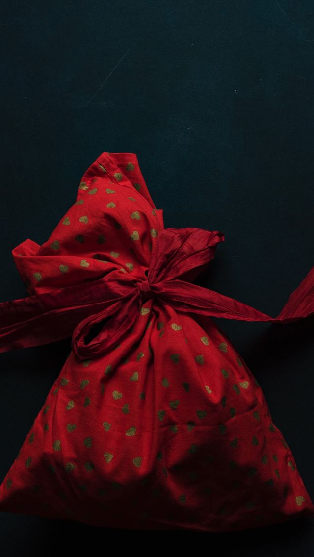 1290x2796 red and gold polka dot drawstring pack on black su... - hearts iPhone Wallpaper