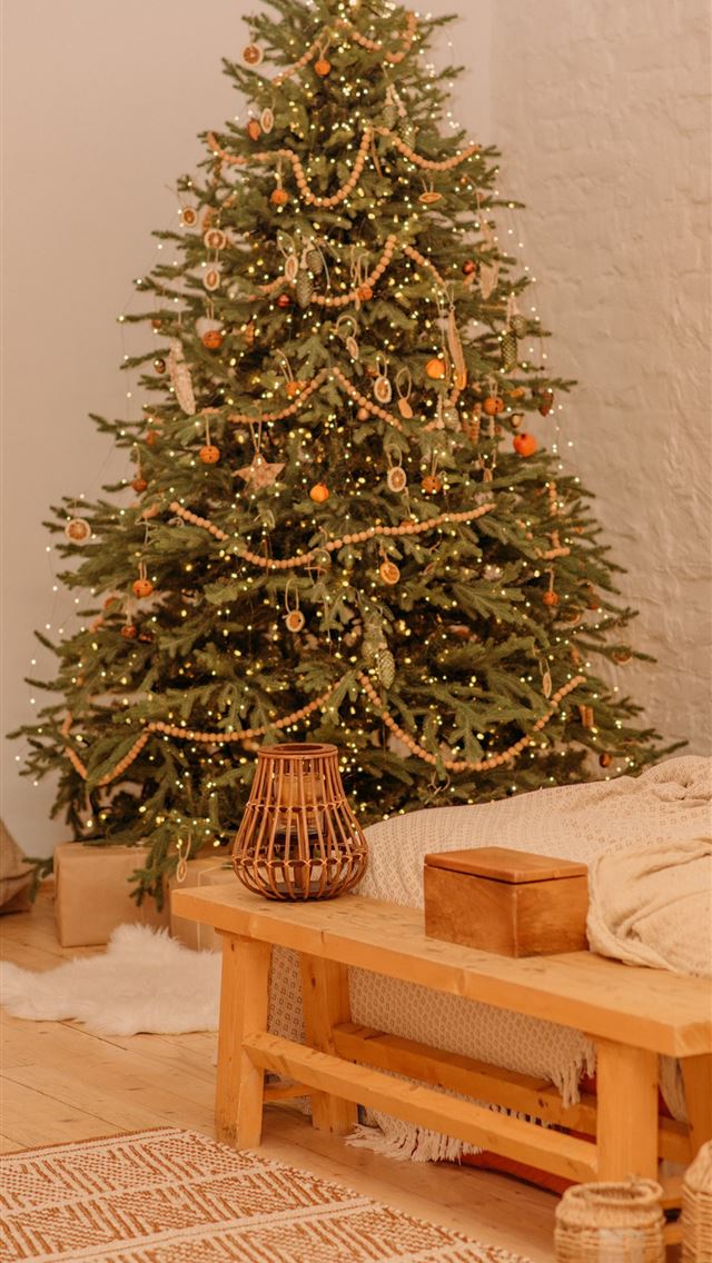 1290x2796 green christmas tree on brown wooden table - christmas tree iPhone Wallpaper