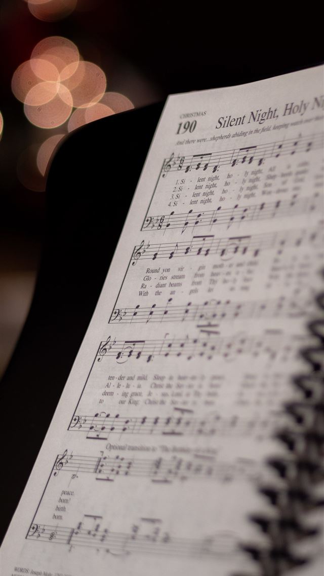 1290x2796 opened musical book at Silent Night Holy Night pag... - grey iPhone Wallpaper