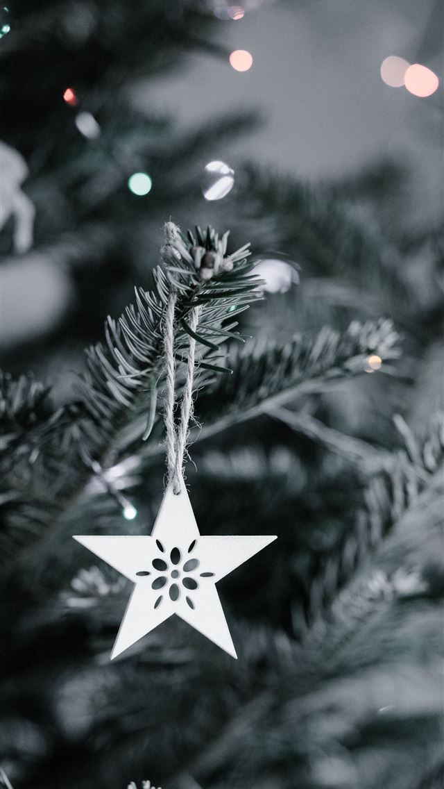 1290x2796 star Christmas ornament hanging in Christmas tree - lights iPhone Wallpaper