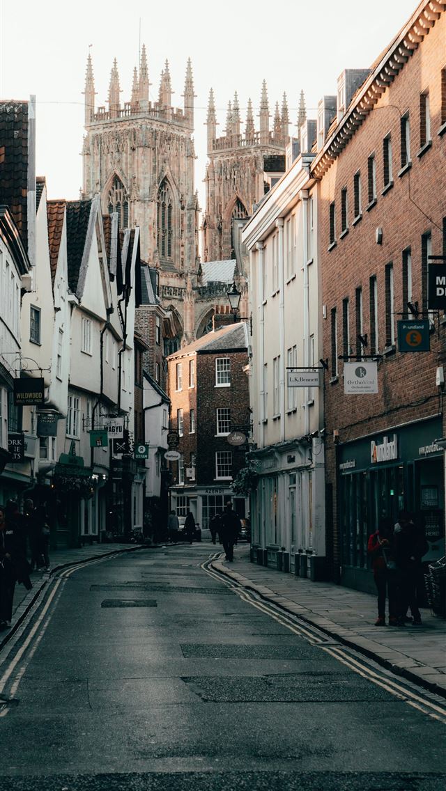 1290x2796 people walking on street between buildings during ... - sunset iPhone Wallpaper