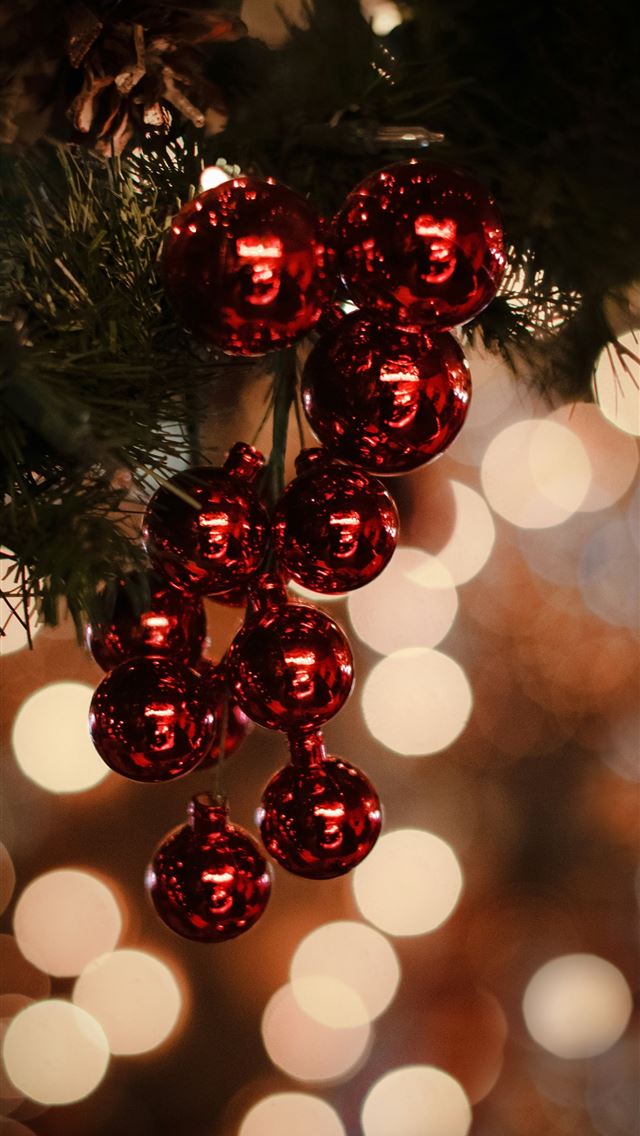1290x2796 macro photography of red Christmas baubles - tree iPhone Wallpaper