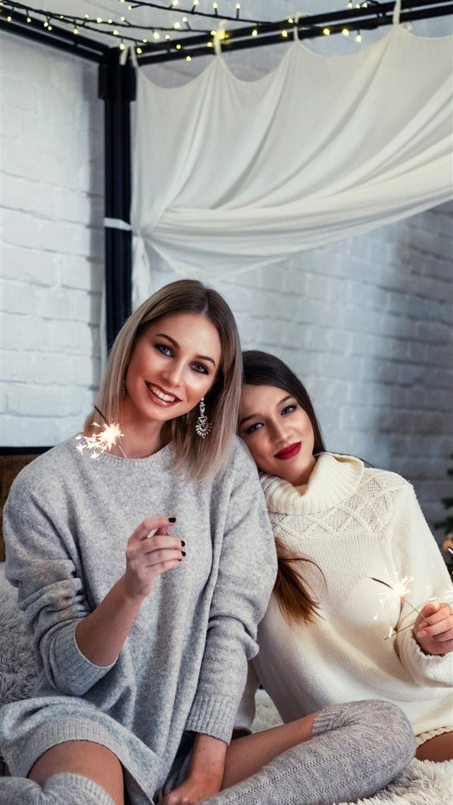 1290x2796 two woman sitting in 4 poster bed frame - lights iPhone Wallpaper