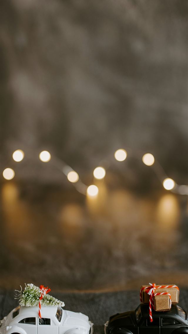 1290x2796 closeup photo of two Volkswagen Beetle toys - holiday iPhone Wallpaper